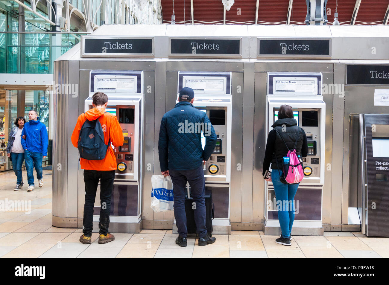 Paddington Railway Station, London, UK. Passengers buying tickets at