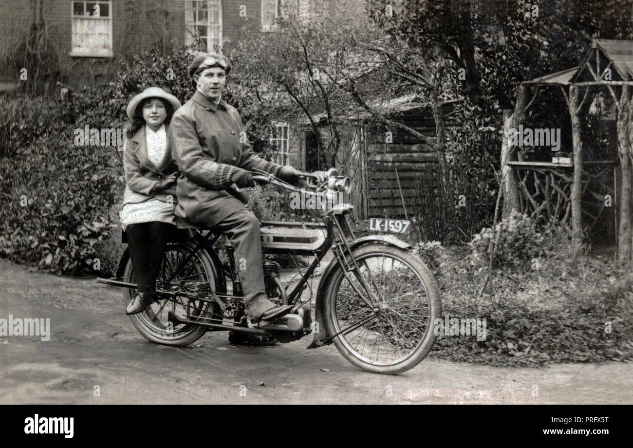 Man and young girl on a 1911 Triumph Model H side valve 500cc motorcycle circa 1911 Stock Photo