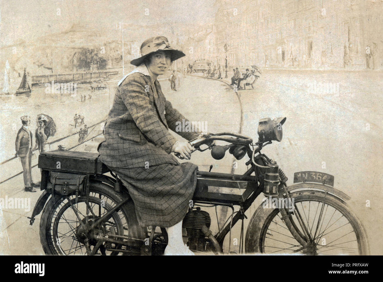 Lady posing for photograph on a 1914 BSA 500cc motorcycle in a studio circa 1915 Stock Photo