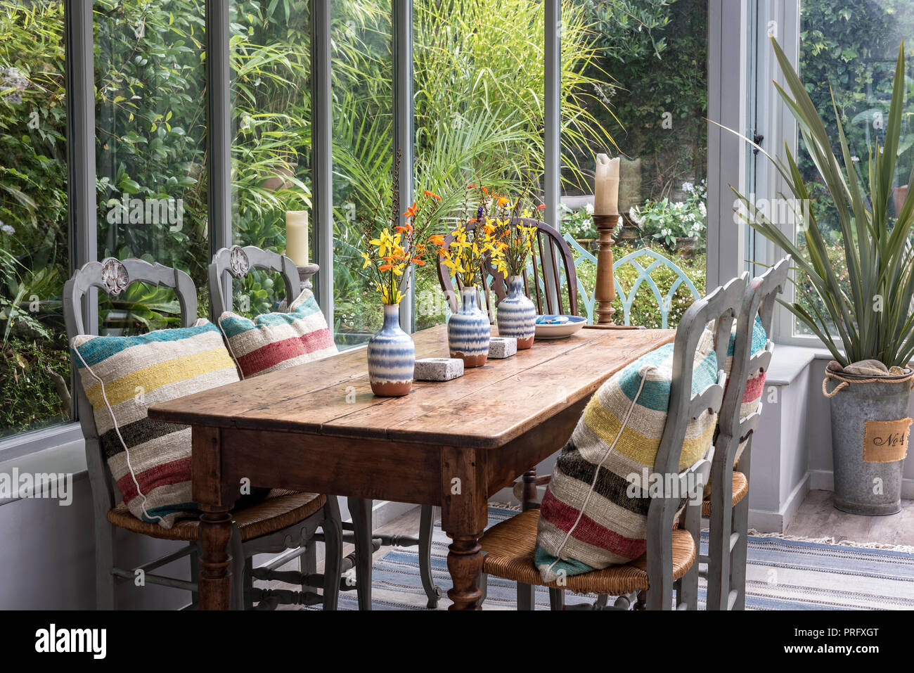 Antique cherrywood dining table in conservatory Stock Photo Alamy