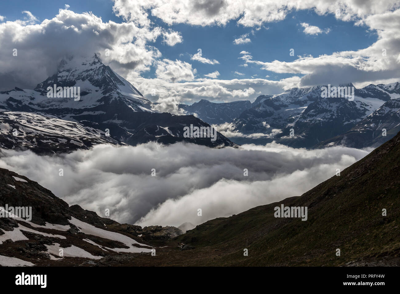View of  Matterhorn peak above clouds, Pennine Alps, Switzerland. Stock Photo