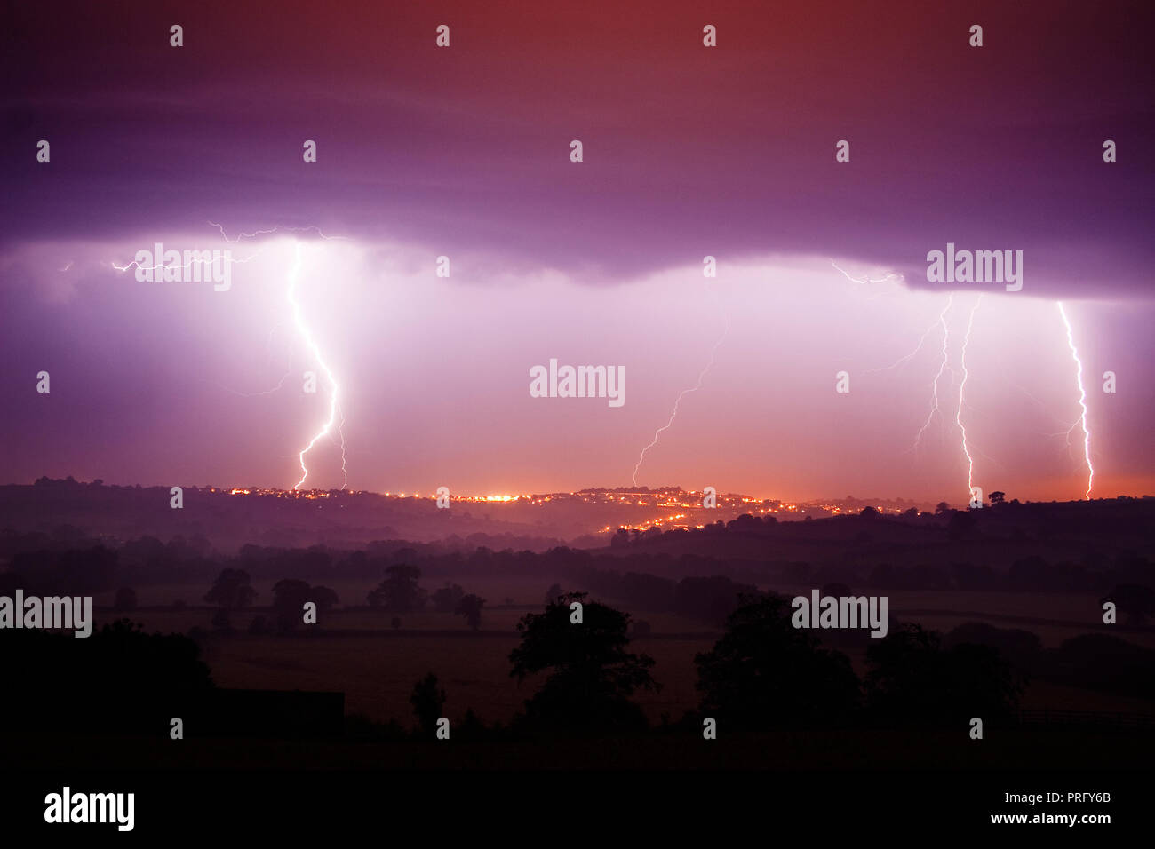 Lightning over Launceston town, Cornwall, UK Stock Photo