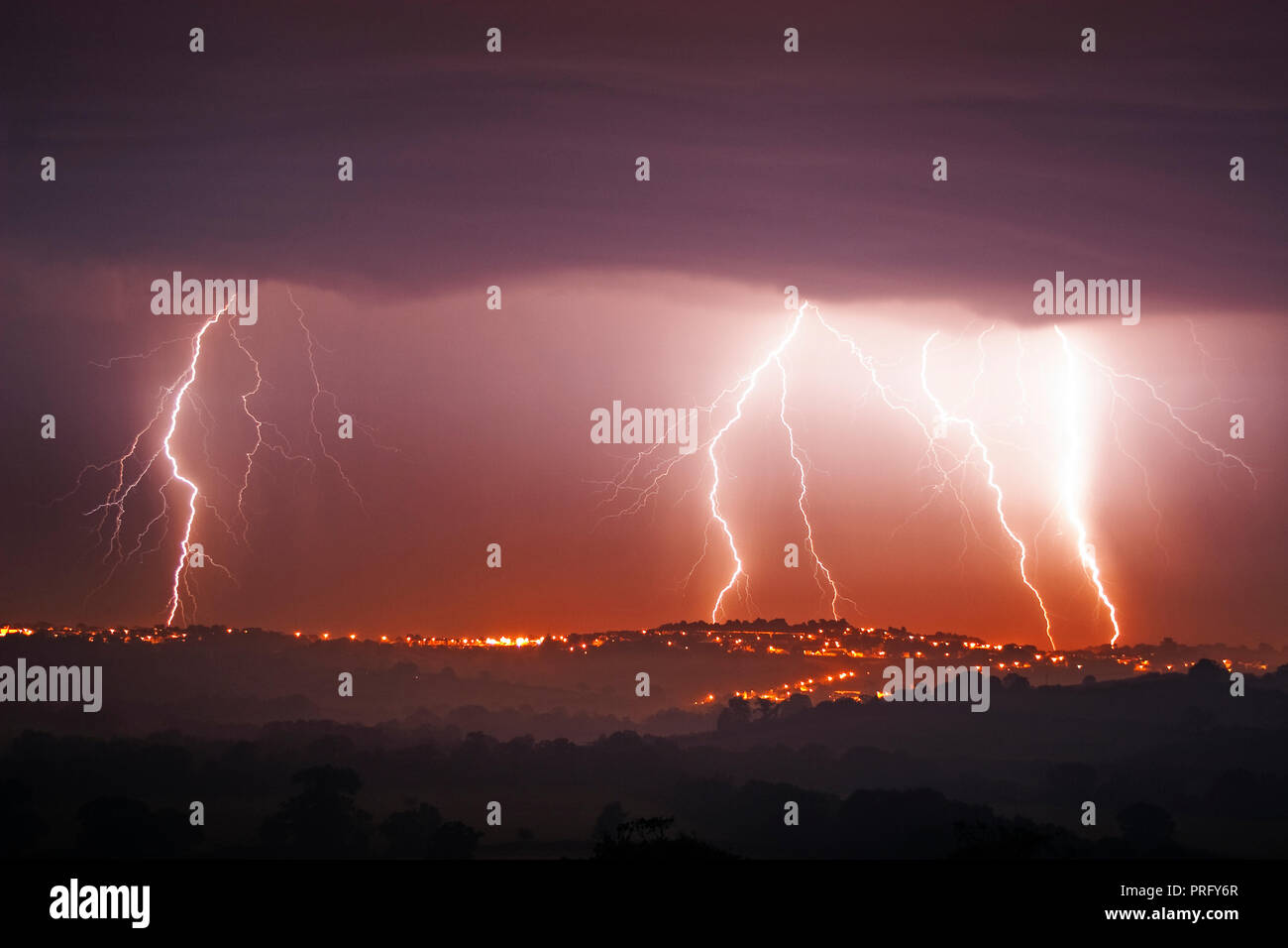 Lightning over Launceston town, Cornwall, UK Stock Photo