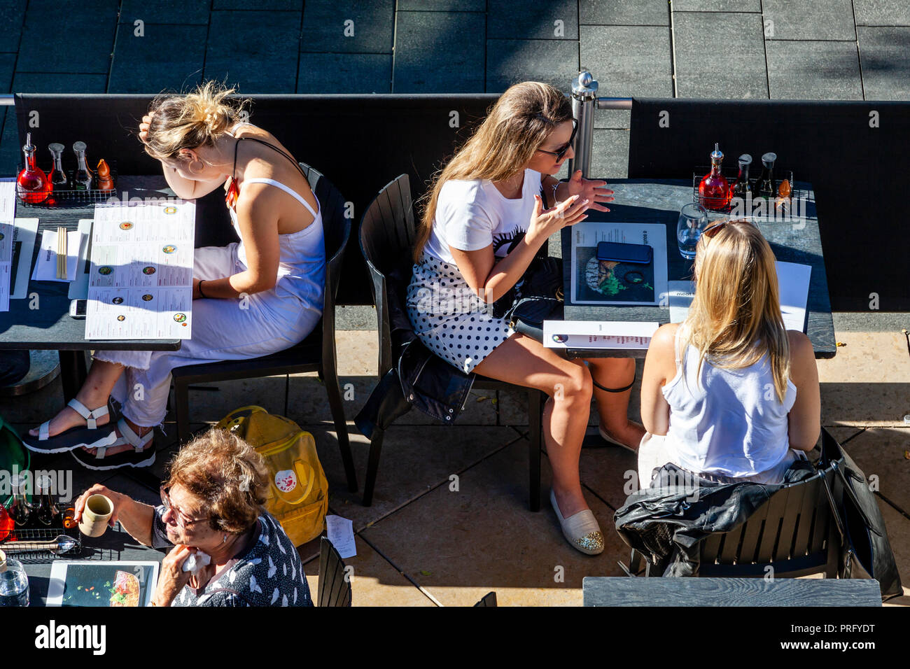 People Sitting At A Riverside Restaurant On The Southbank, London, UK Stock Photo