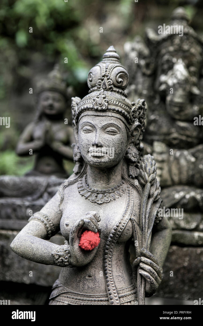 Stone sculpture of Hindu deity in Bali, Indonesia Stock Photo
