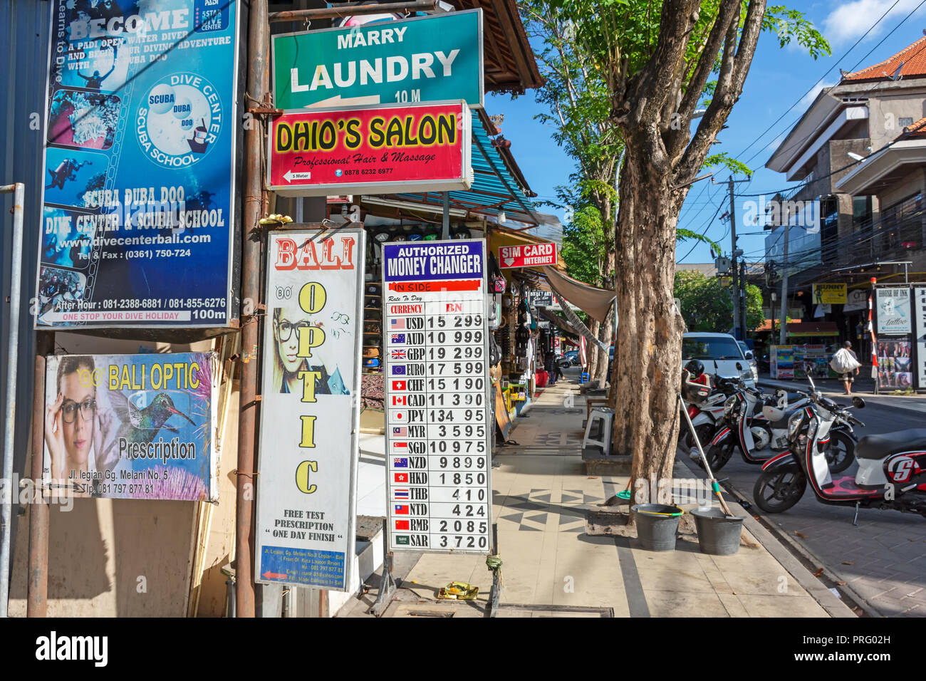 Kuta, Indonesia - September 14, 2018: Rows of business signages at Legian street in Kuta. Legian is famous among tourist for nightclub and entertainme Stock Photo