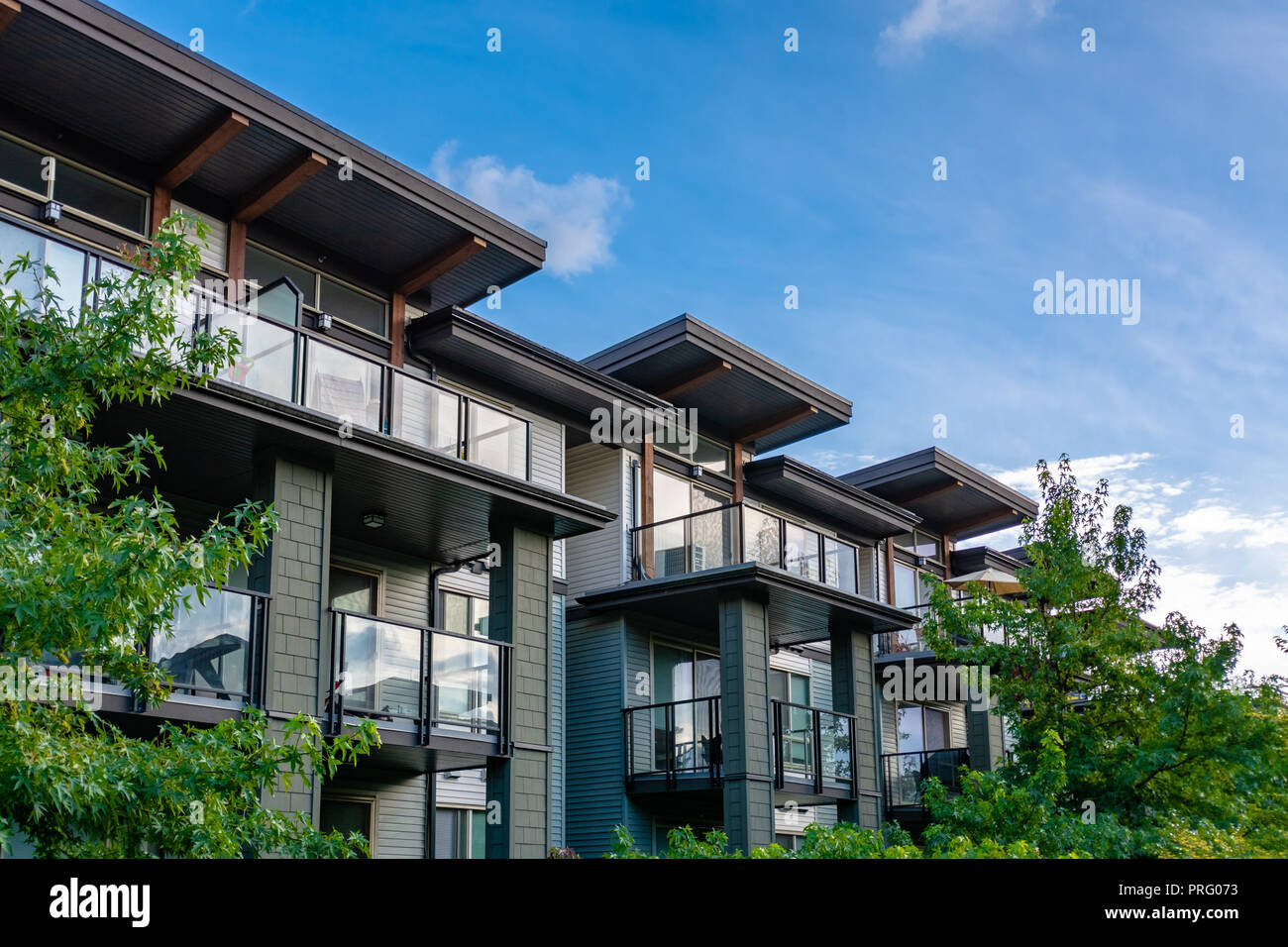 Top of residential building on blue sky backdrop Stock Photo - Alamy