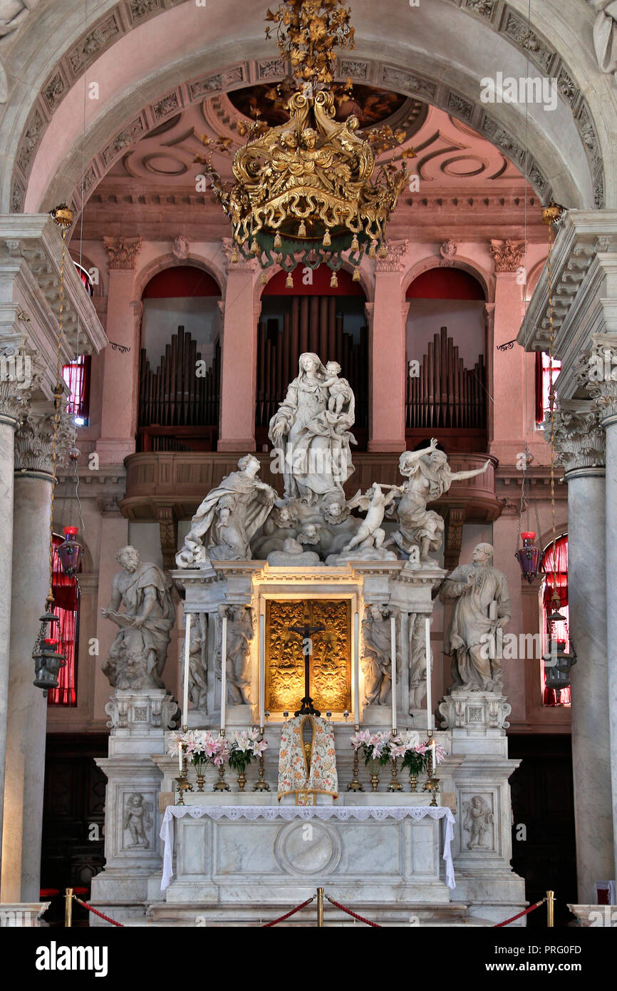 The altar in the Santa Maria della Salute, a Roman Catholic church in Venice, Italy. Also known as the Basilica of Saint Mary of Health. Stock Photo