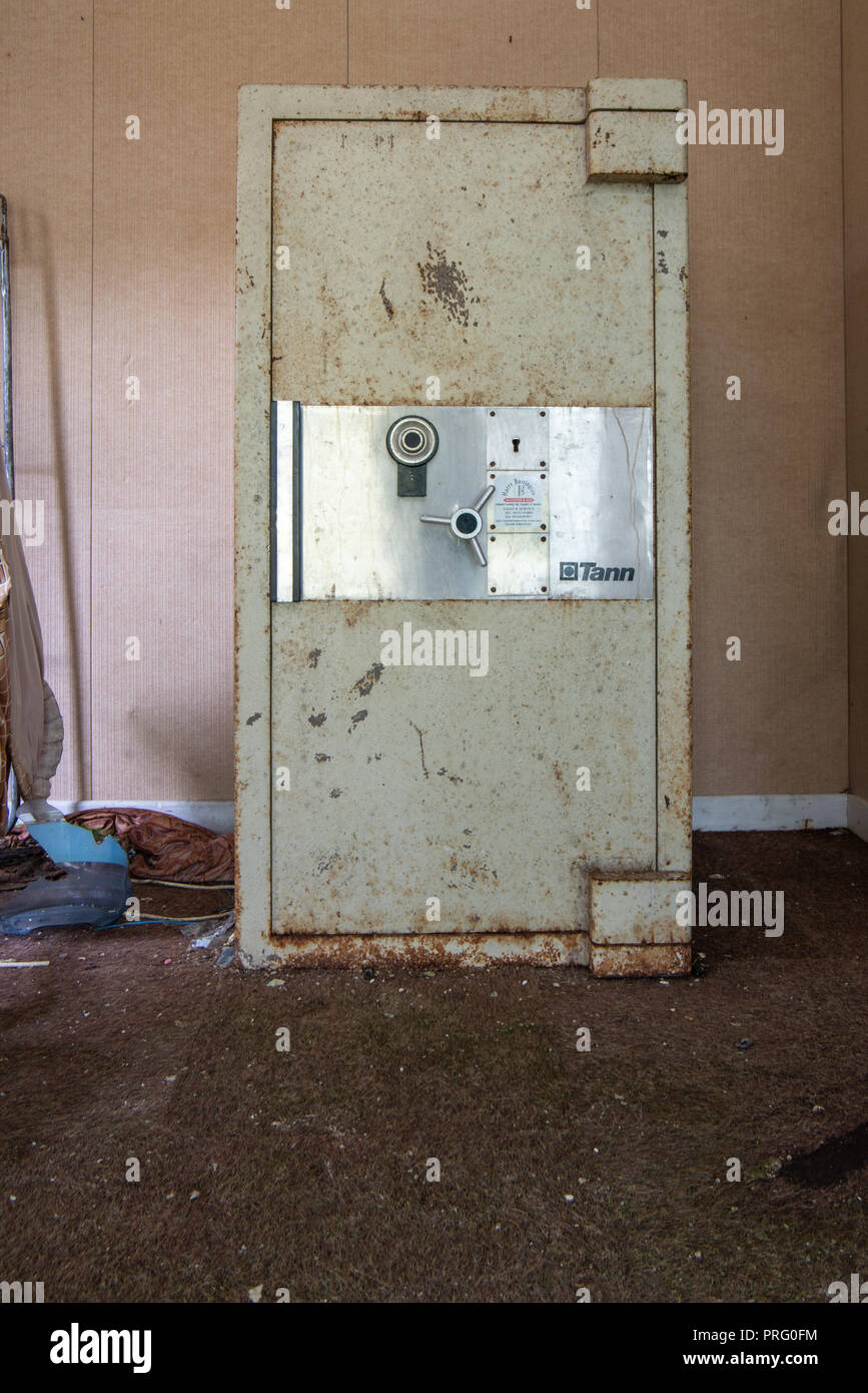 Large Tann safe in an abandoned office. Stock Photo