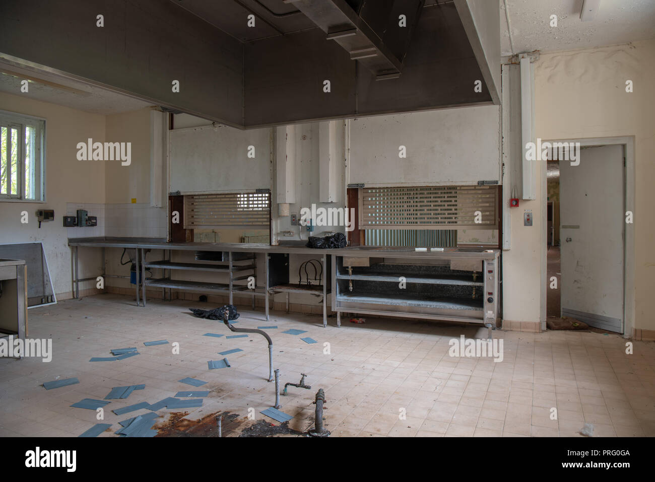 Large kitchen inside an abandoned prison. Stock Photo
