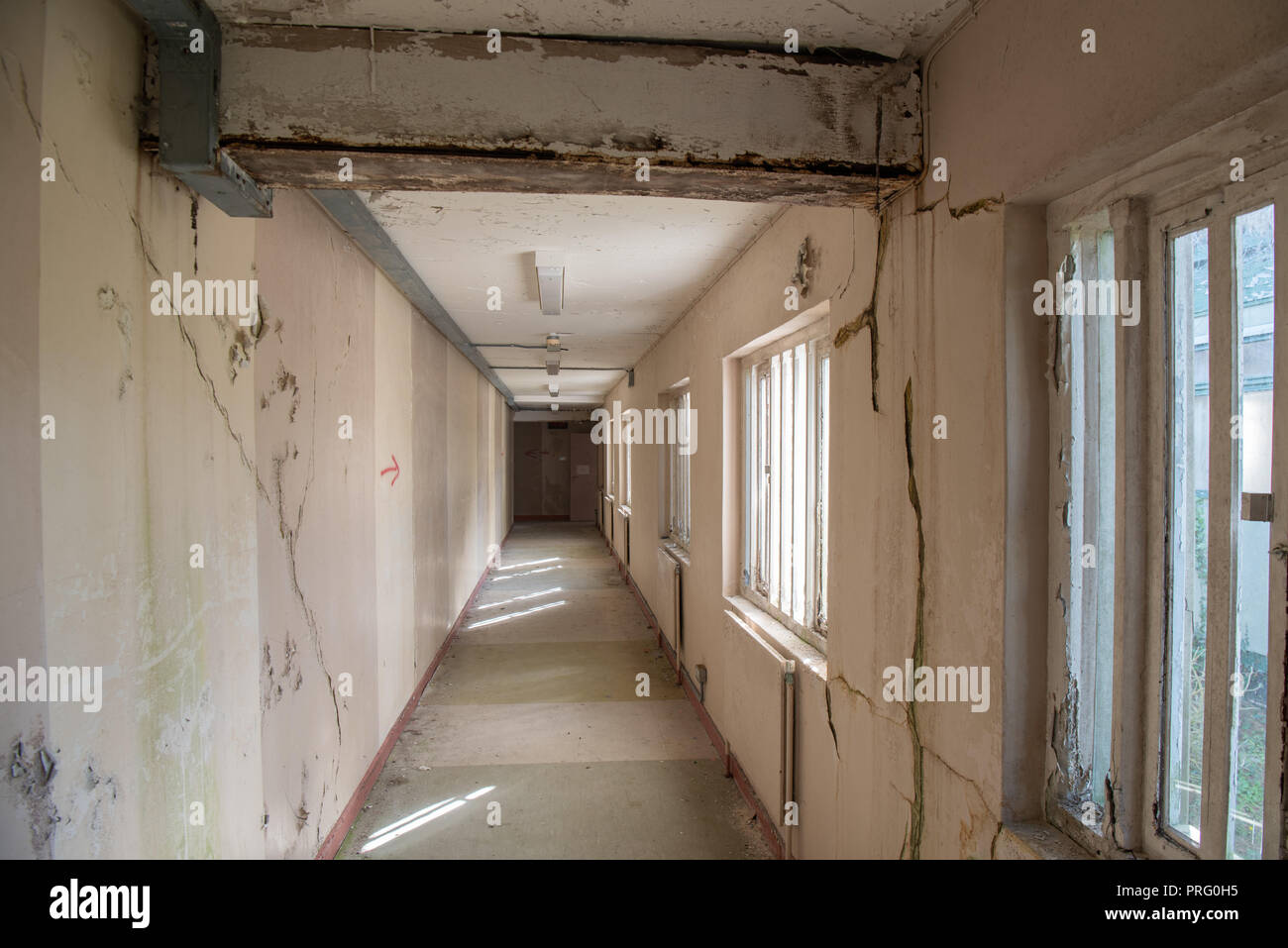 Corridor inside an abandoned prison with windows with steel bars Stock ...