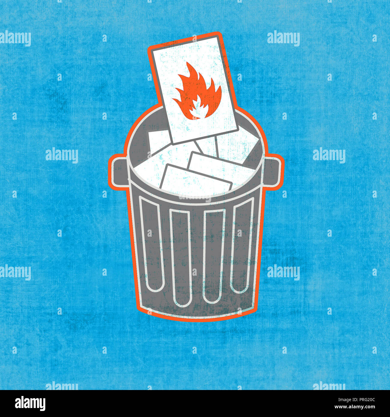 paper on fire falls into trash can Stock Photo