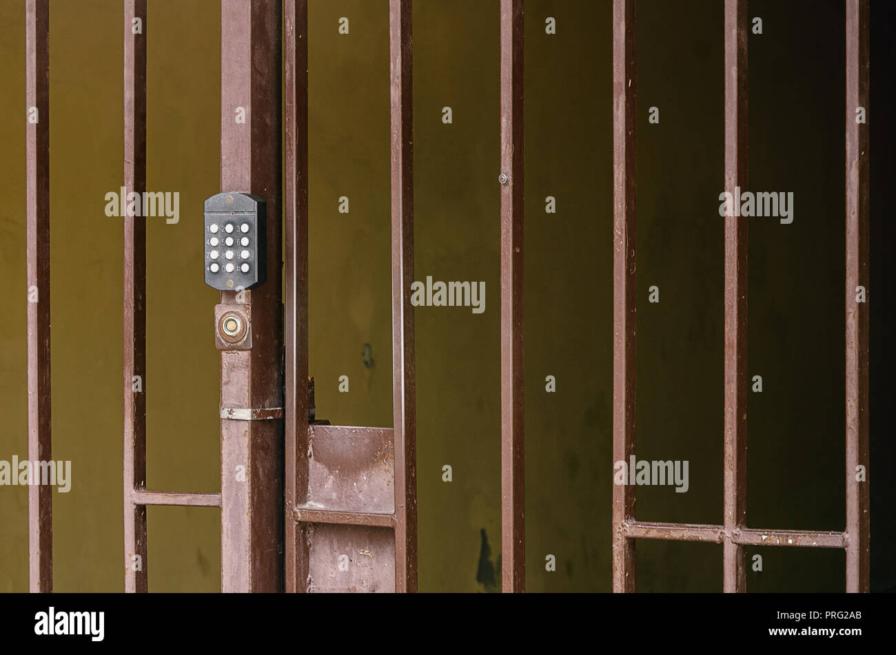 metal fence with a code intercom on the gate Stock Photo - Alamy