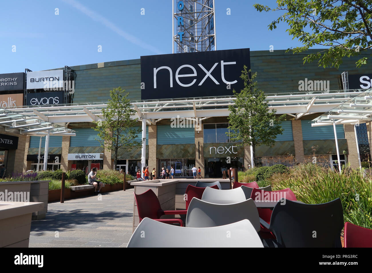 Shop signs at Glasgow Fort Shopping Centre Stock Photo Alamy