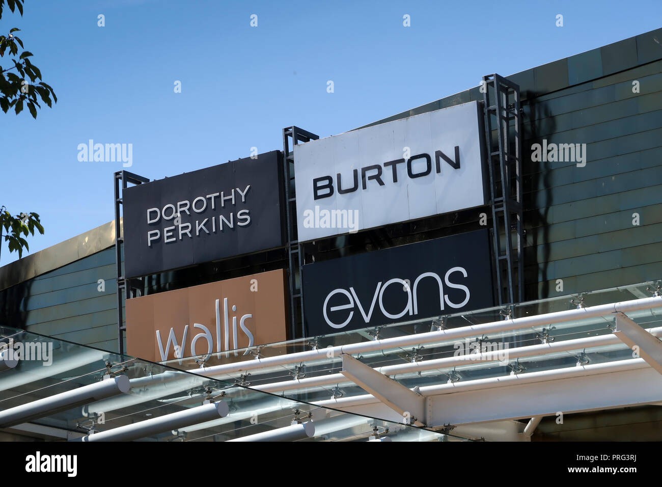 Shop signs at Glasgow Fort Shopping Centre Stock Photo Alamy