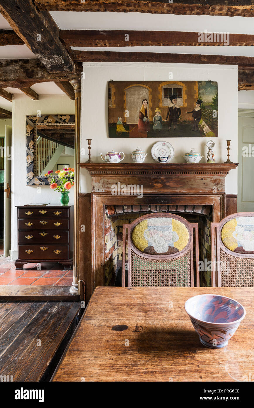 Ornaments On Fireplace With Artwork In Dining Room Once