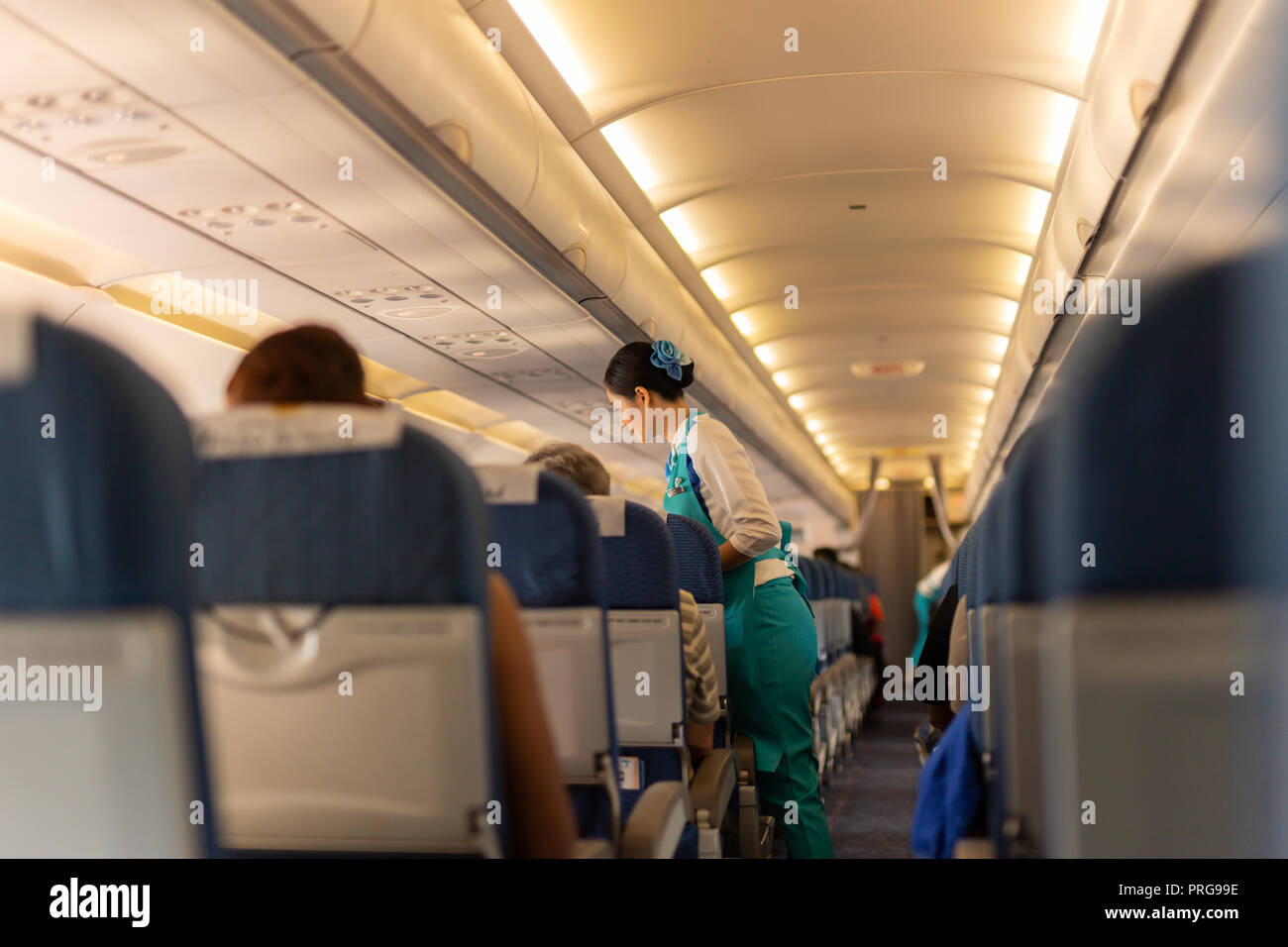 BANGKOK, THAILAND Sep 27, 2018 Flight attendant serve food to