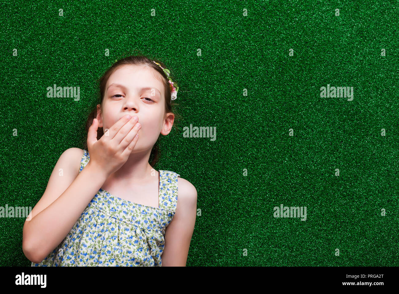 Little Girl Is Lying On Artificial Grass She Is Tired And Needs To