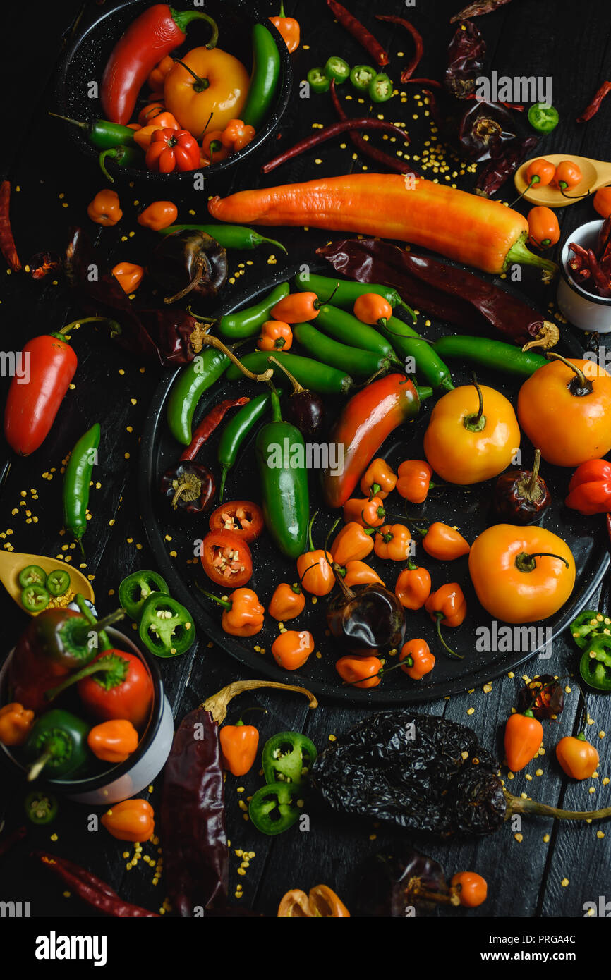 Variety of chili peppers. Some sort of habanero, manzano, serrano and pasilla pepper. Very spicy Stock Photo