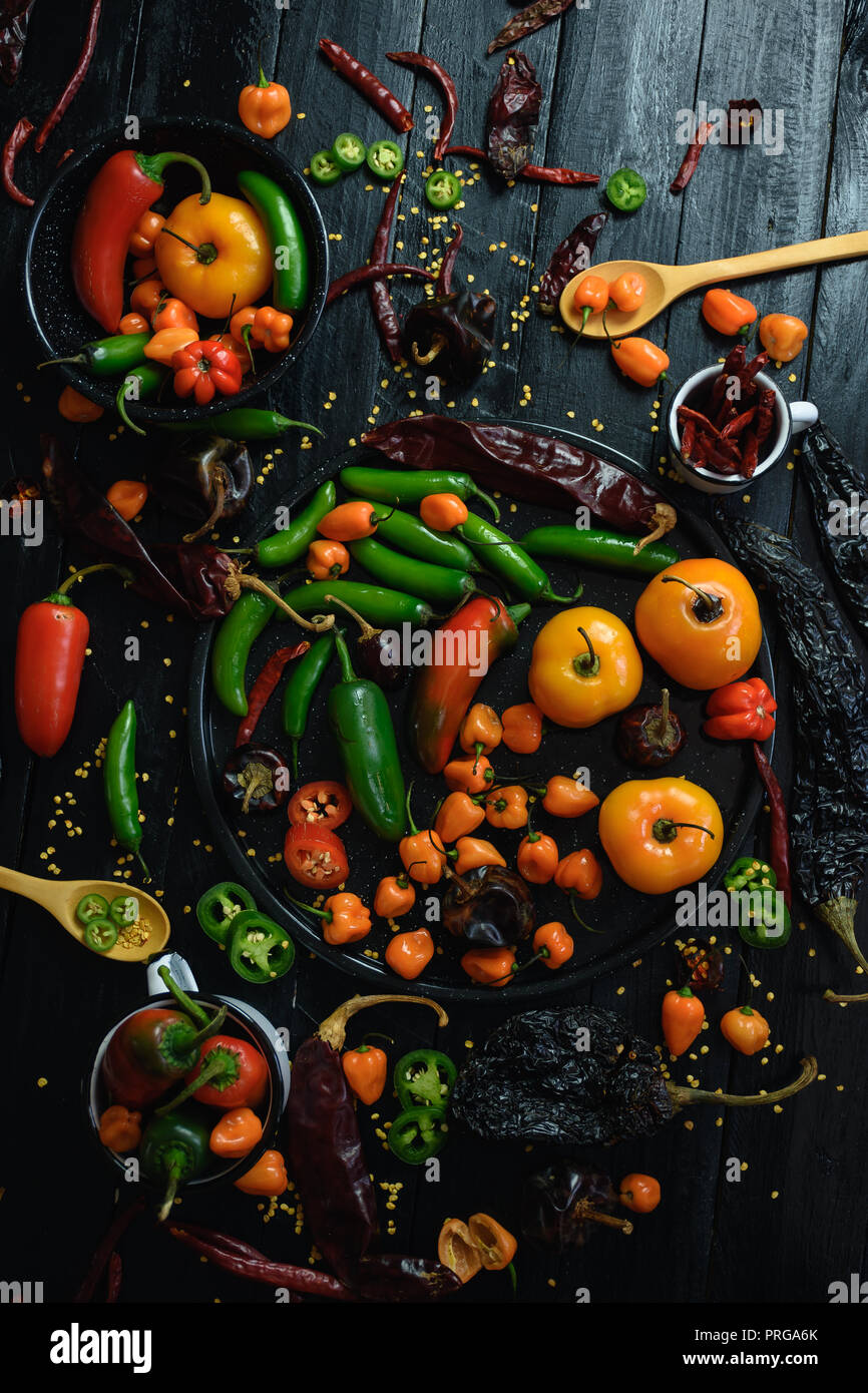 Variety of chili peppers. Some sort of habanero, manzano, serrano and pasilla pepper. Very spicy Stock Photo