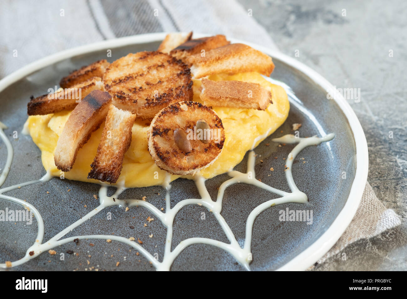Spider omelette for Halloween kids breakfast Stock Photo - Alamy