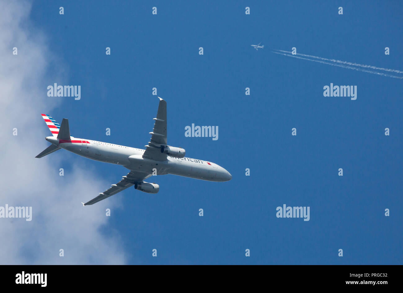 CHARLOTTE, NC (USA) - October 1, 2018:  Two commercial airliners at different altitudes occupying the same air space. Stock Photo