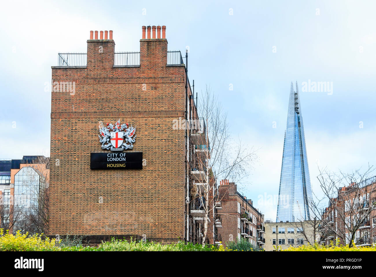 City of London housing estate in Great Guildford Street, Southwark, London, UK, the Shard in the background Stock Photo
