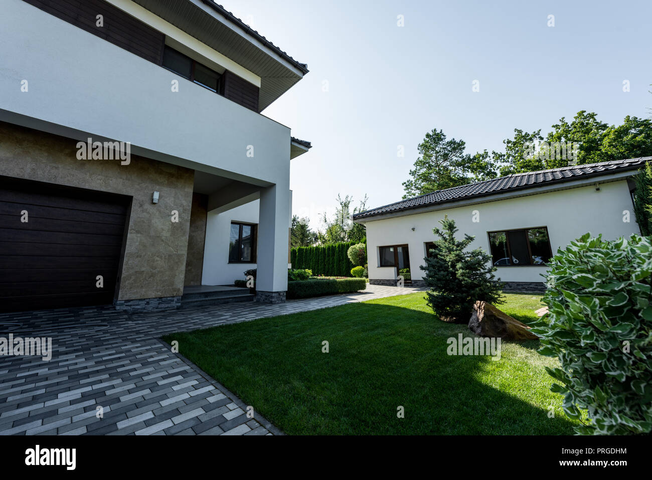 modern private house with green lawn and garden Stock Photo - Alamy