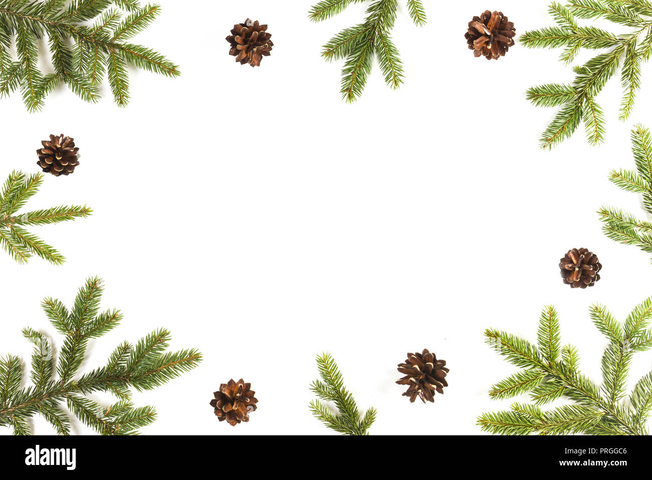 Christmas background with fir branches and pine cones on white ...