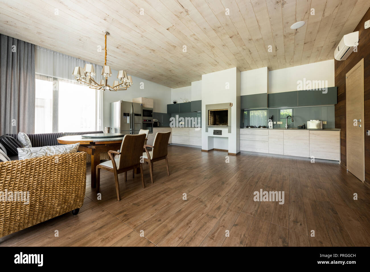interior view of stylish empty kitchen and dining room Stock Photo