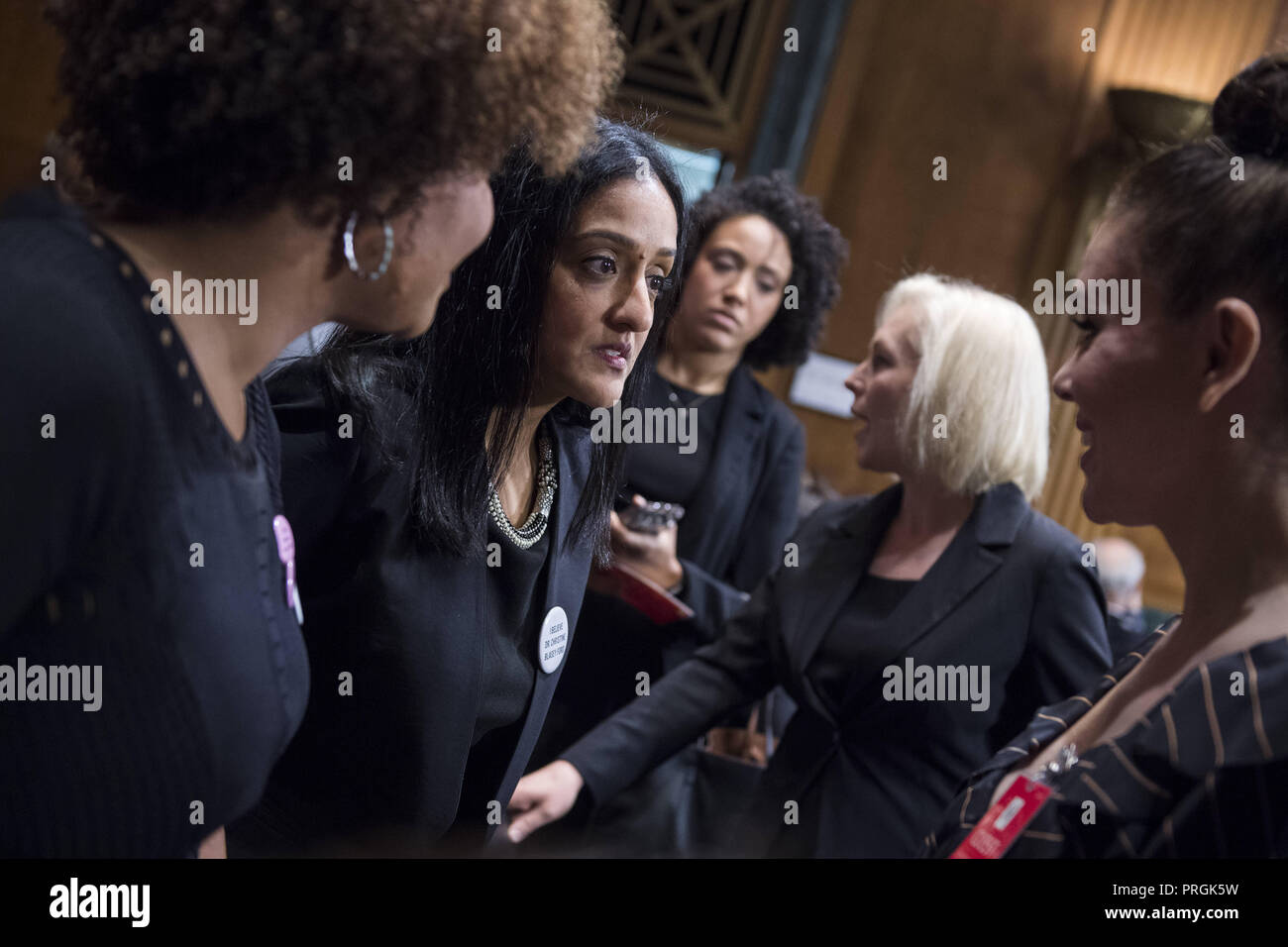 Washington, DC, USA. 27th Sep, 2018. UNITED DCS - SEPTEMBER 27: Vanita Gupta, second from left, talks with Actress Alyssa Milano, right, in the hearing room before the start of Dr. Christine Blasey Ford's appearance in the Senate Judiciary Committee to testify on the nomination of Brett M. Kavanaugh to be an associate justice of the Supreme Court of the United States. (Photo By Tom Williams/CQ Roll Call) Credit: Tom Williams/CNP/ZUMA Wire/Alamy Live News Stock Photo