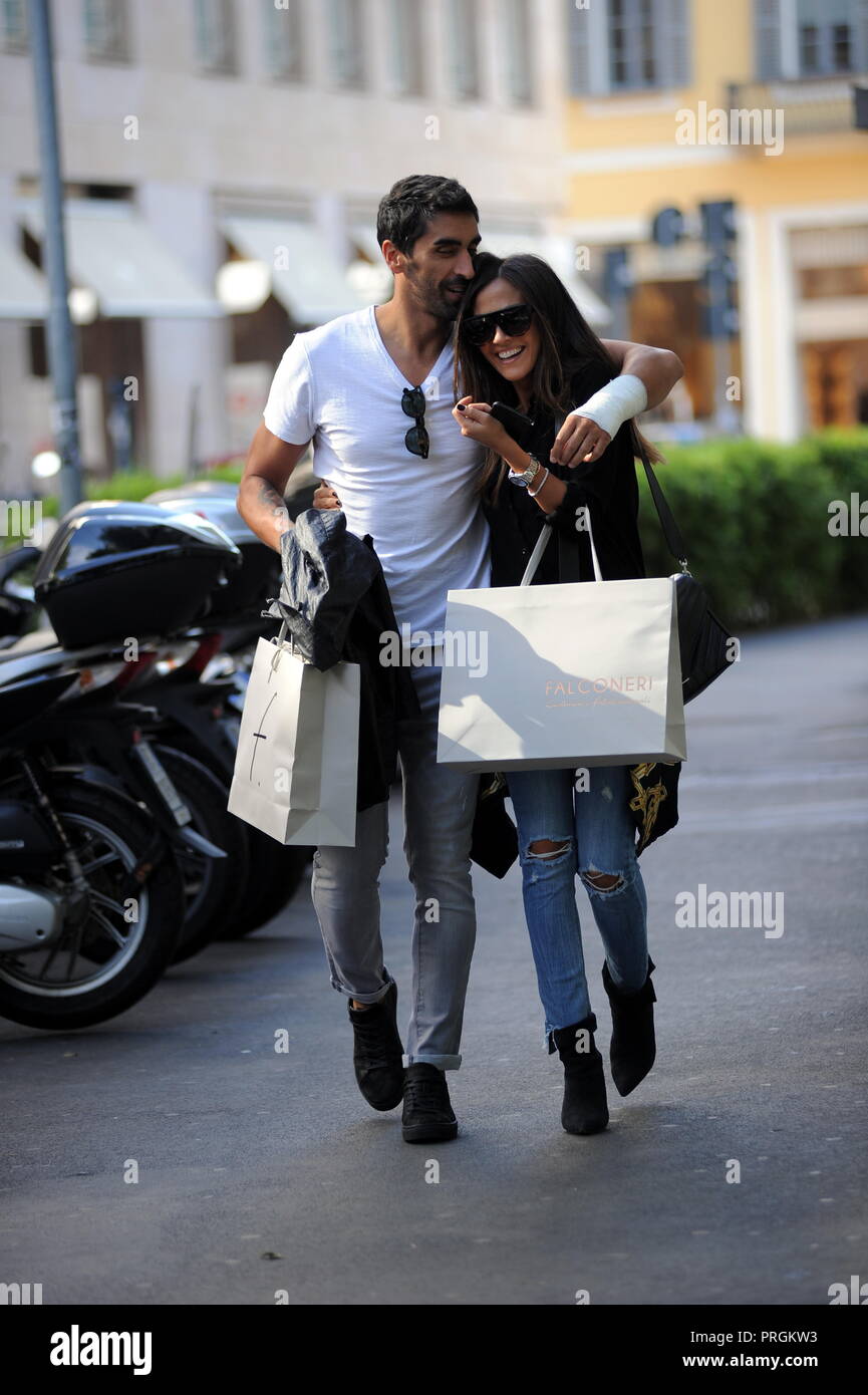 Milan, Filippo Magnini and Giorgia Palmas shopping by Falconeri Filippo Magnini, with his arm bandaged following a motorcycle accident last day, arrives downtown with his girlfriend GIORGIA PALMAS, and they go to 'FALCONERI' to do some shopping. They go upstairs to try on sweaters and sweaters, then after more than an hour they come down and hug each other and take a long walk to get to their car to go home. Stock Photo