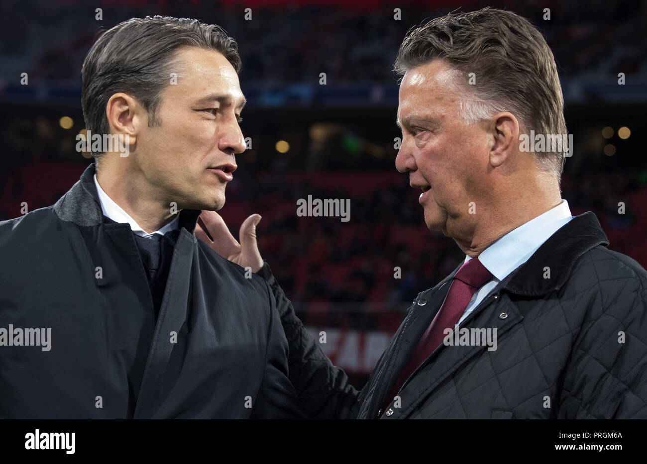 Munich, Bavaria. 2nd  Oct, 2018. Munich, Bavaria. 02nd Oct, 2018. 02 October 2018, Germany, Munich: Soccer: Champions League, Bayern Munich vs Ajax Amsterdam, Group stage, Group E, 2nd matchday in the Allianz Arena. Munich coach Niko Kovac (L) talks to former Bayern coach Louis van Gaal before the match. Credit: Sven Hoppe/dpa/Alamy Live News Credit: dpa picture alliance/Alamy Live News Stock Photo