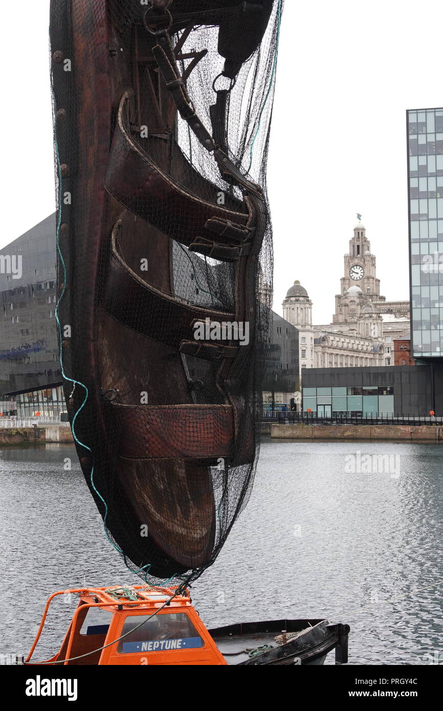 Liverpool, UK. 3rd October 2018. A giant sandal appears at the Royal Albert  Dock, all part of Royal De Luxe Giants spectacular in Liverpool this  weekend. Credit: Ken Biggs/Alamy Live News Stock