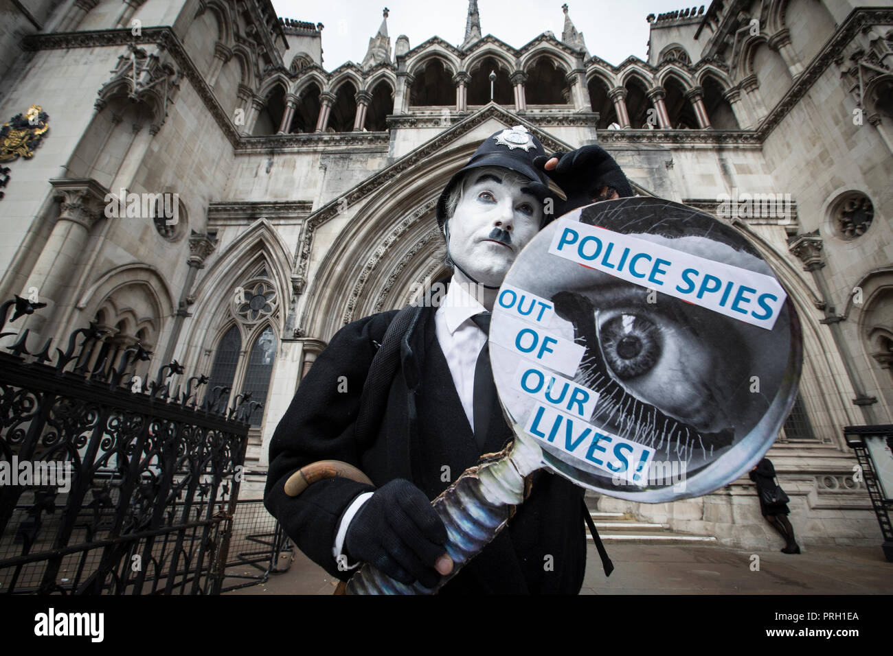 London, UK. 3rd Oct 2018. Protester Against Undercover Police Officers outside High Court, Royal Courts of Justice, London, UK 3rd October 2018. The public have been shocked that women have been deceived into intimate relationships with undercover police officers in the United Kingdom. One woman is bringing a case about the human rights abuses she suffered in her relationship with undercover police officer Mark Kennedy while he infiltrated social and enviromental campaign groups. Credit: Jeff Gilbert/Alamy Live News Stock Photo