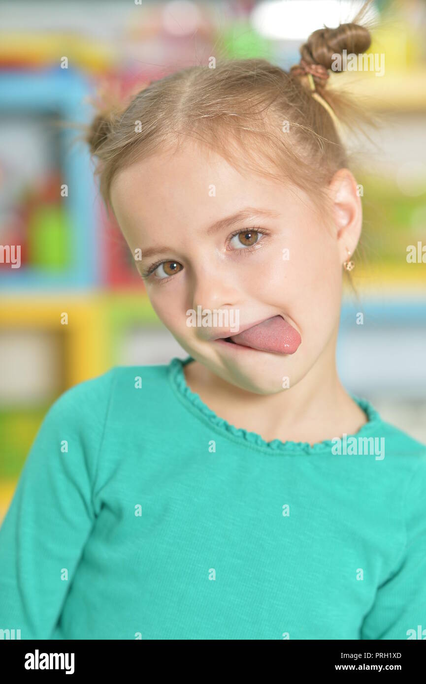 Portrait Of Cute Little Girl Making Funny Faces Stock Photo Alamy