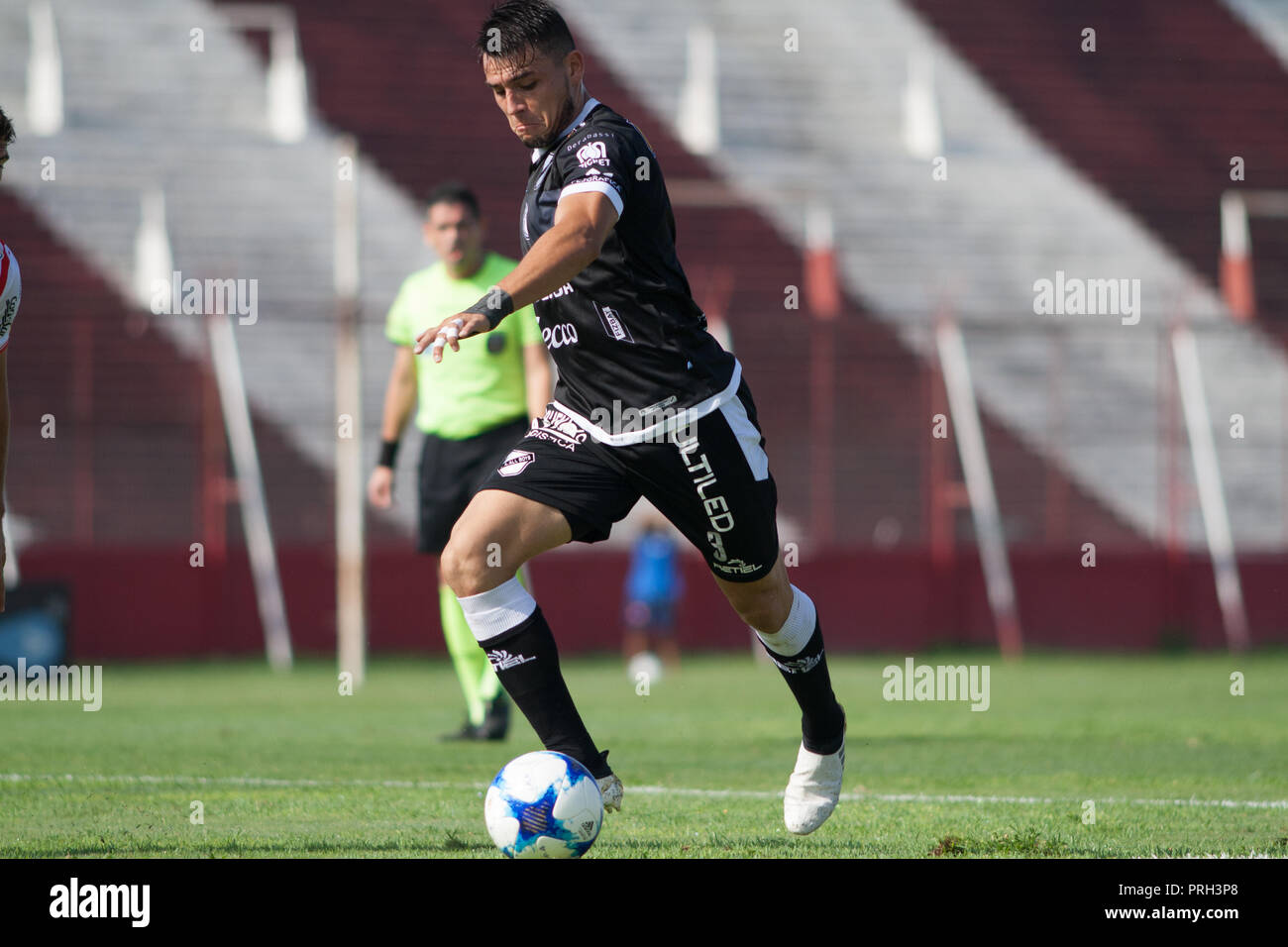 The football player, Gastón García, stands with the ball during a football match of the argentinian league in Buenos Aires, 22 of april of 2018 Stock Photo