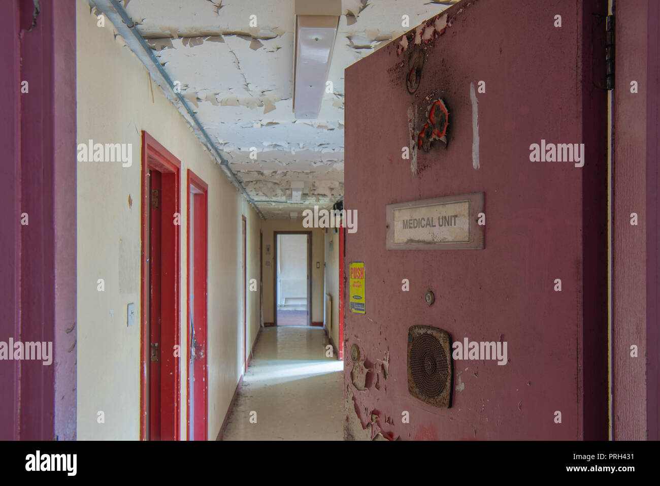 Door at the medical unit wing of an abandoned prison. Stock Photo