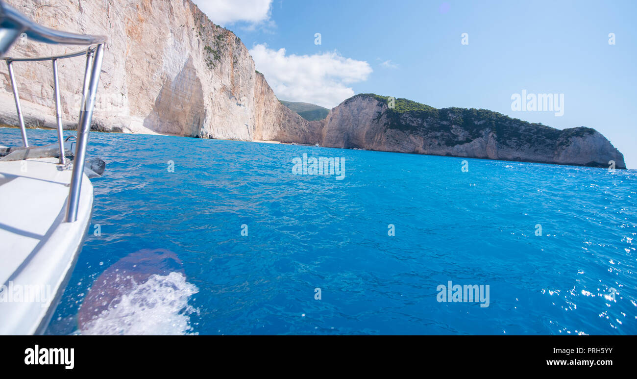 Ship sailing into the bay Navagio at island Zakynthos. Stock Photo