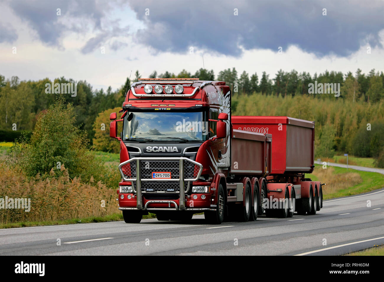 Salo, Finland - September 28, 2018: Red Scania R730 truck and gravel trailer for limestone haul of R Aalto on the road in autumn in South of Finland. Stock Photo