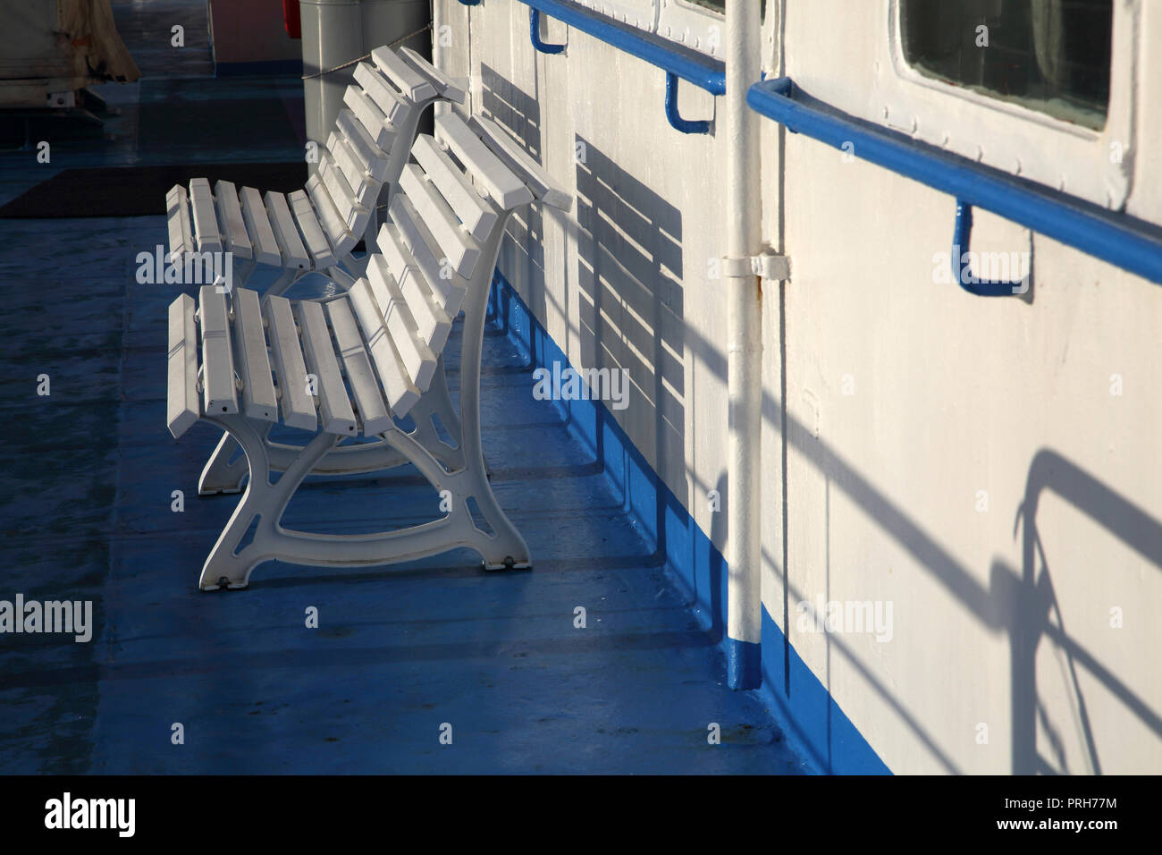 Lavrio Port Attica Greece Seats on Ferry casting Shadows Stock Photo
