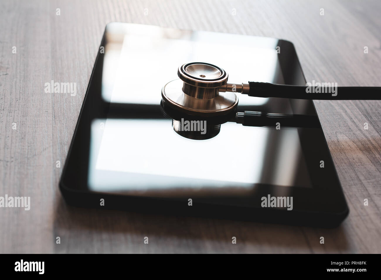 Stethoscope On A Tablet Computer With Reflection Fixing A Broken