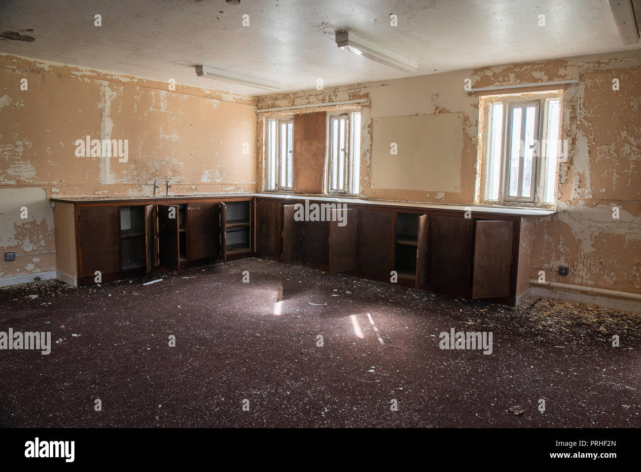 Stripped-out kitchen in an abandoned prison. Stock Photo