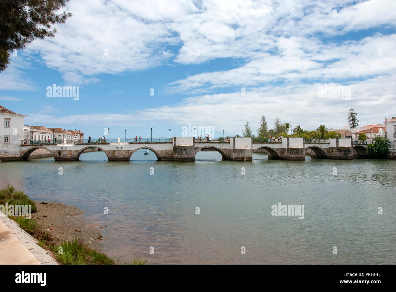 The 12th Century Seven Arched Roman Bridge and Dry River Tavira Portugal downstream view of the ancient 12th century seven 7 arches of the Roman Bridg Stock Photo