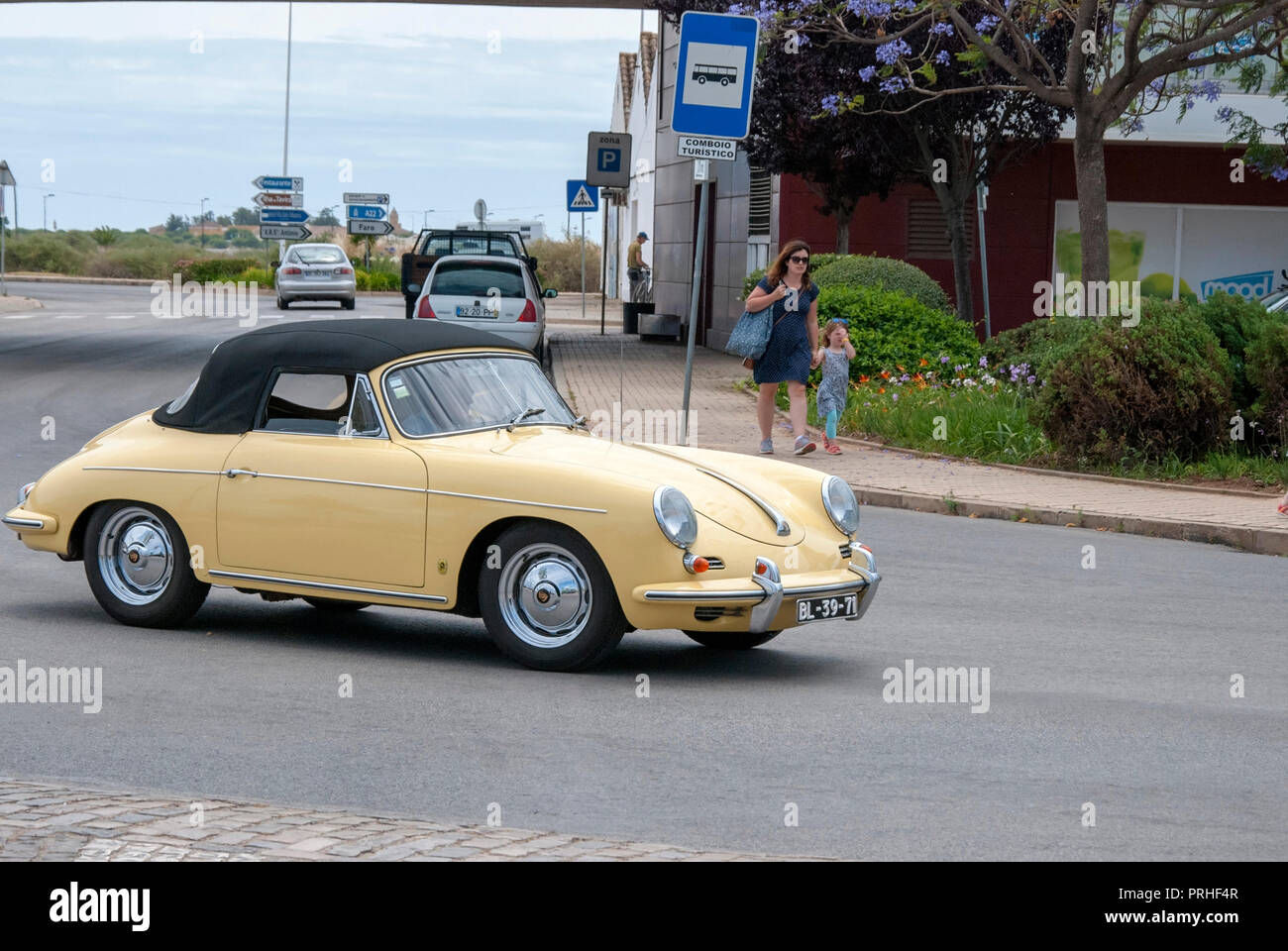 Cream Yellow 1950's Porsche 356 A Convertible Vintage Sportscar front right passenger view of yellow cream colour porsche 356A convertible soft top ra Stock Photo