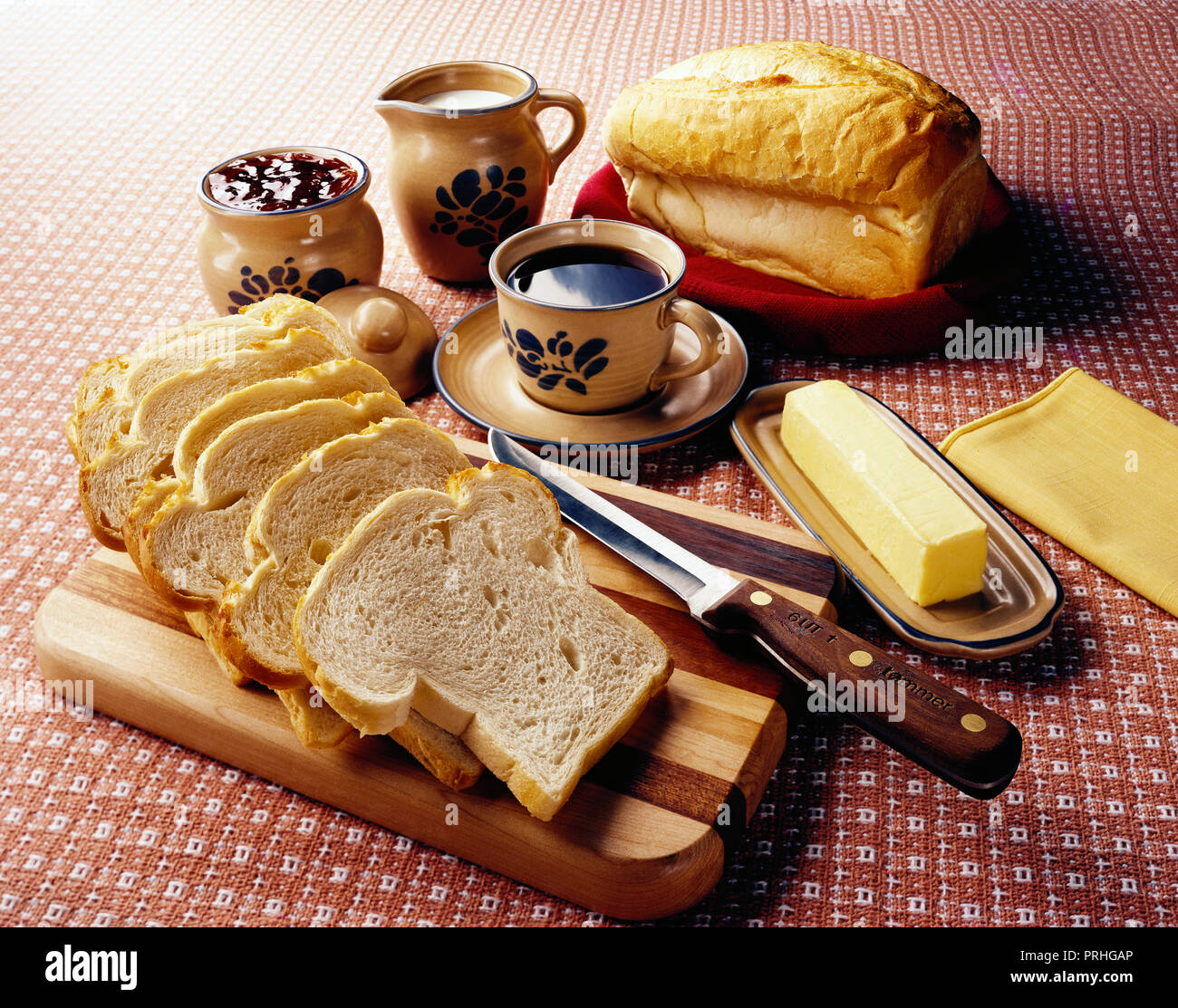 Still Life Of Sliced Bread Butter Coffee Milk Jam Knife And Cutting Board On A Table Stock Photo Alamy Still Life Of Sliced Bread Butter Coffee Milk Jam Knife And Cutting Board On A Table Stock Photo Alamy