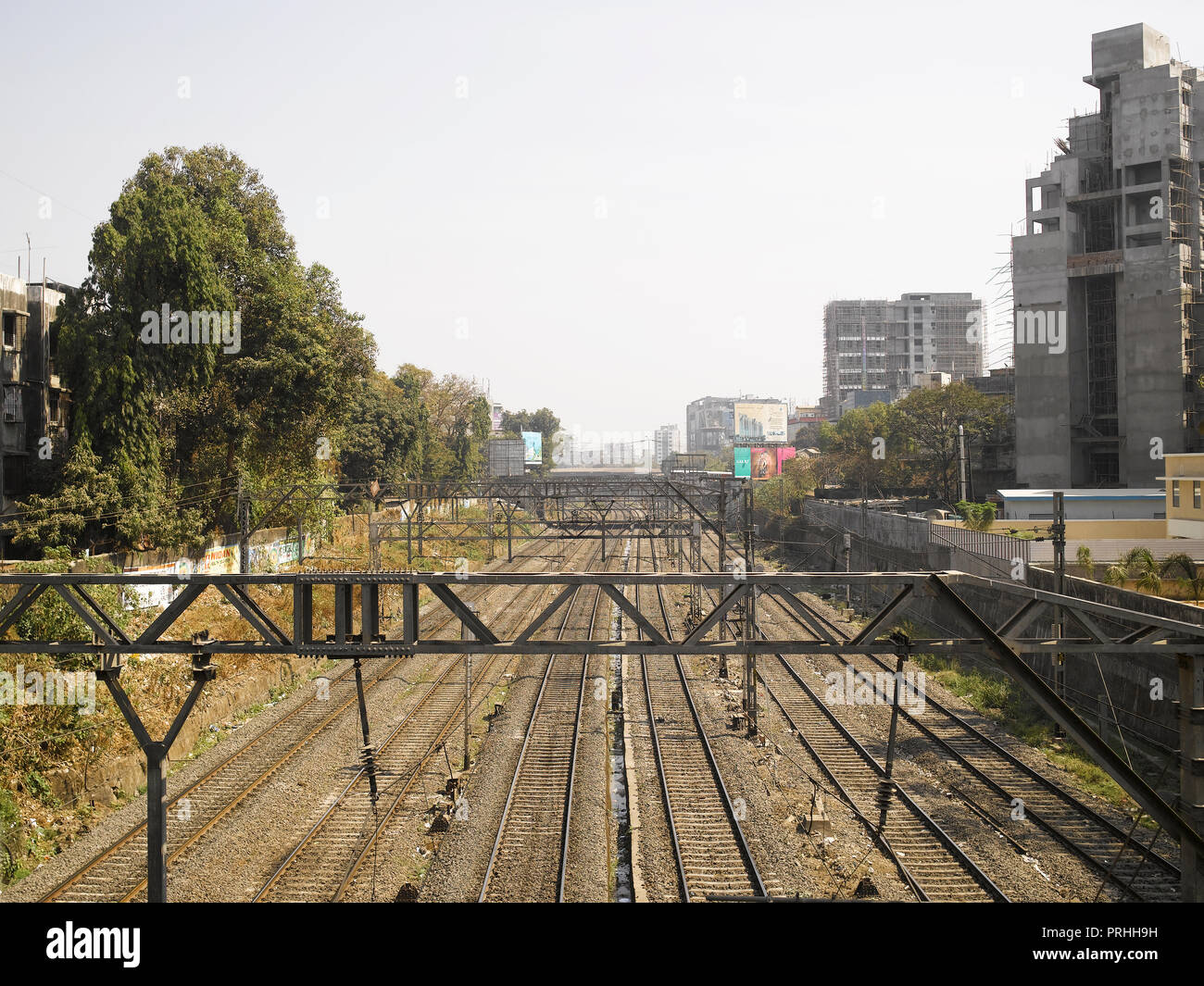 VIEW OF RAILWAY TRACKS AND LOCAL TRAINS IN MUMBAI, INDIA, ASIA Stock Photo