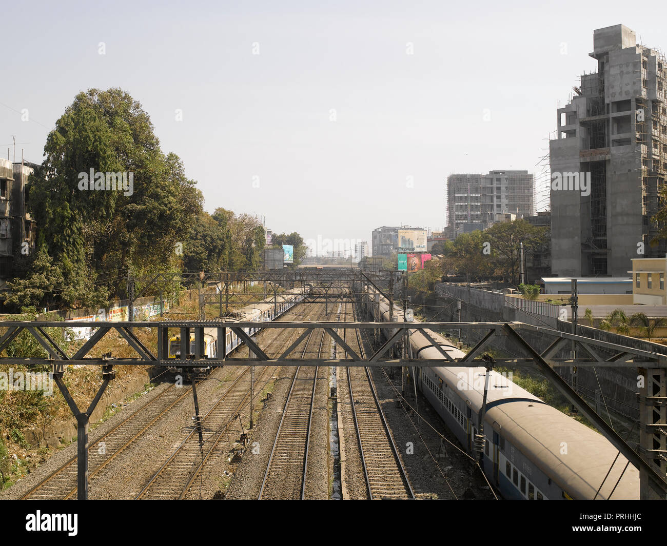 VIEW OF RAILWAY TRACKS AND LOCAL TRAINS IN MUMBAI, INDIA, ASIA Stock Photo