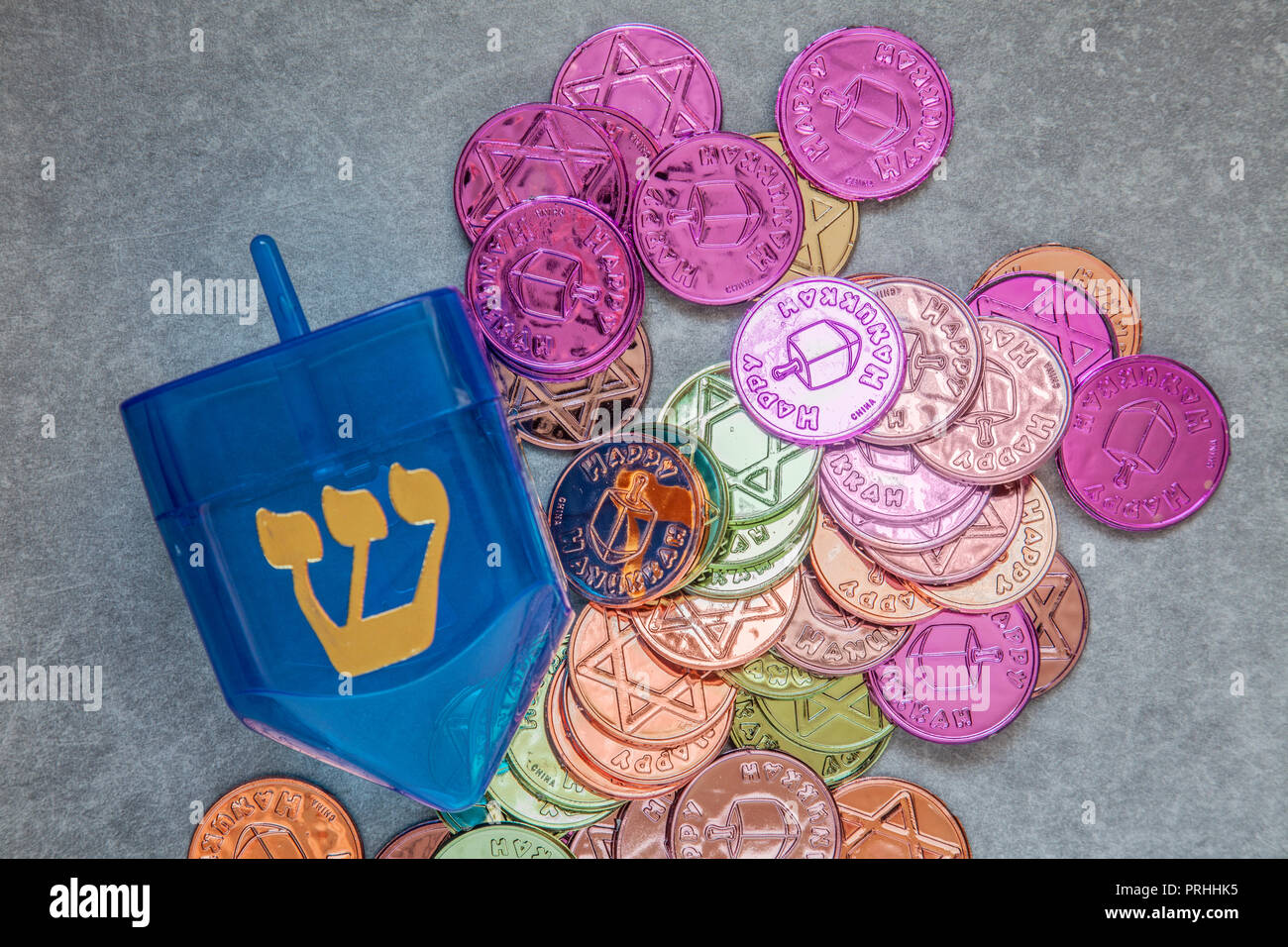 Large translucent blue plastic dreidl showing the Hebrew letter Shin ...