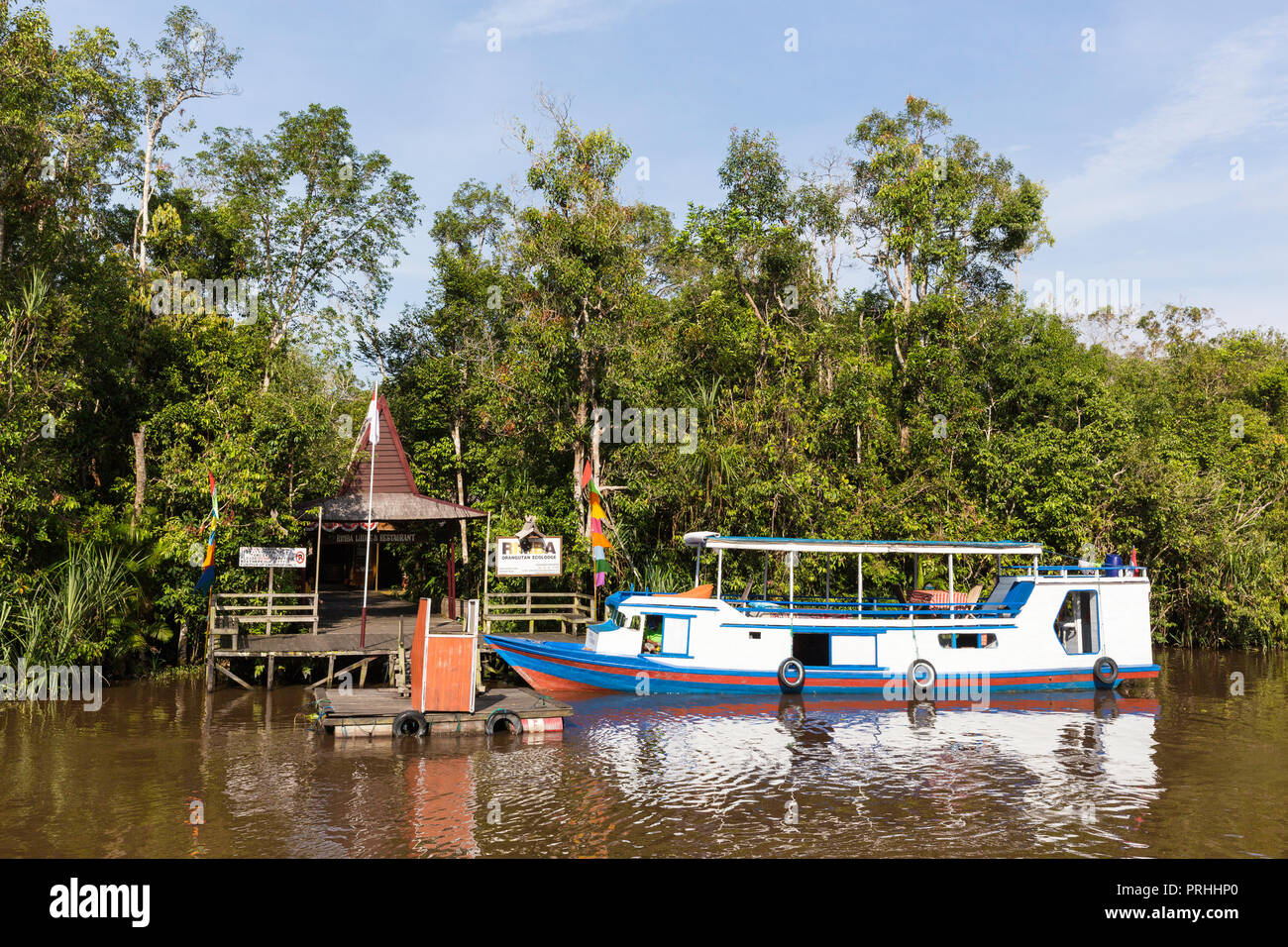 Klotok with tourists on the Sekonyer River, Tanjung Puting National Park, Borneo, Indonesia. Stock Photo